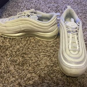 nike white shoes that are shiny in sun
